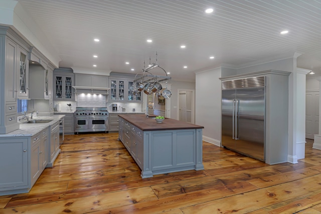 67 Peaceable St, Ridgefield, CT 06877 - kitchen with high end appliances, gray cabinets, wooden counters, recessed lighting, and crown molding