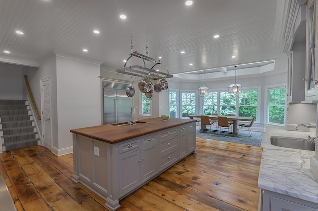 67 Peaceable St, Ridgefield, CT 06877 - kitchen with a sink, stainless steel built in fridge, recessed lighting, hardwood / wood-style floors, and butcher block countertops