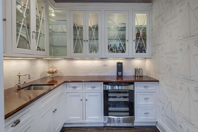 67 Peaceable St, Ridgefield, CT 06877 - indoor bar featuring wine cooler, decorative backsplash, and dark wood-style flooring