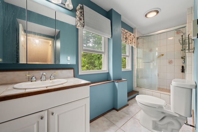 717 Center St, Manchester, CT 06040 - full bath with toilet, tile patterned flooring, vanity, and tiled shower