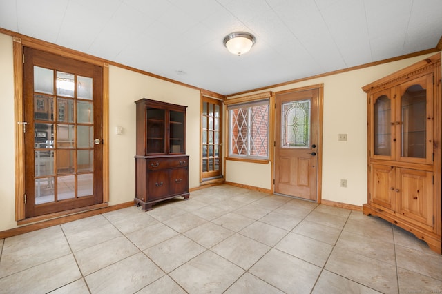 717 Center St, Manchester, CT 06040 - entryway featuring crown molding, baseboards, and light tile patterned floors