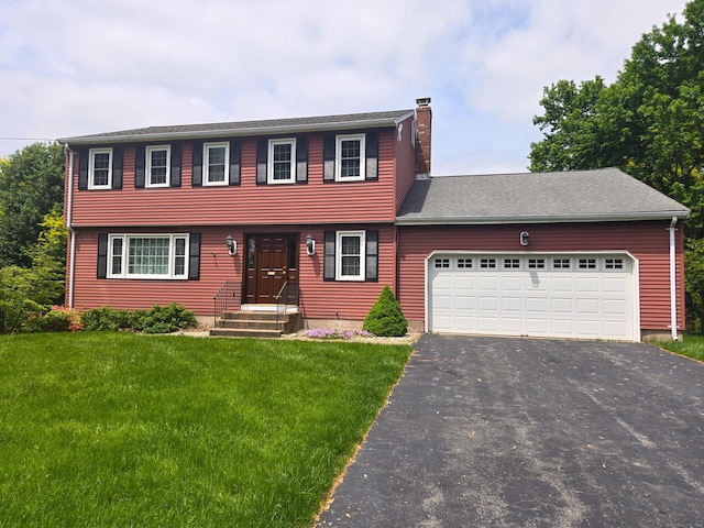 166 Kennedy Rd, Manchester, CT 06042 - colonial home featuring a chimney, driveway, a front lawn, a garage, and roof with shingles