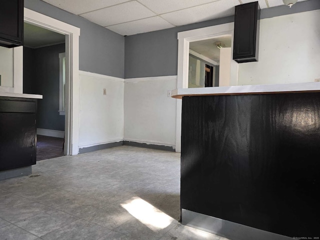 827 Middle Tpke E, Manchester, CT 06040 - unfurnished dining area featuring a drop ceiling and baseboards