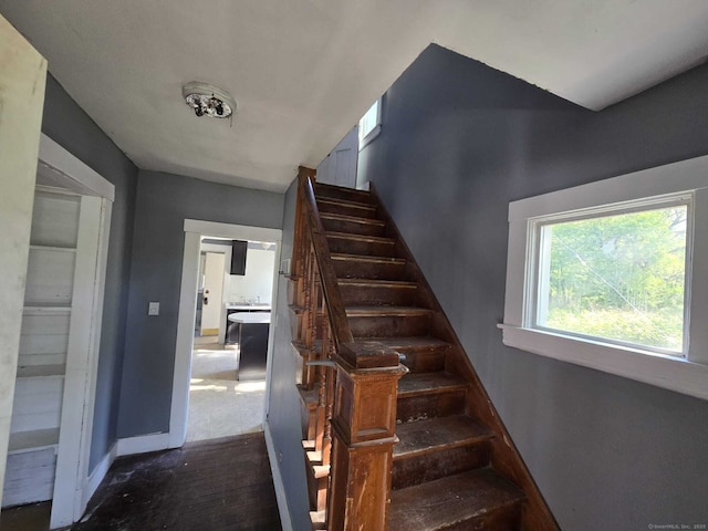 827 Middle Tpke E, Manchester, CT 06040 - staircase featuring baseboards and wood finished floors