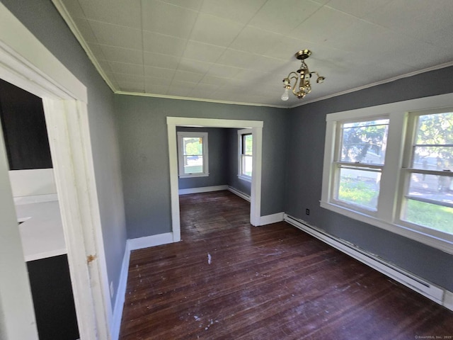 827 Middle Tpke E, Manchester, CT 06040 - spare room with dark wood finished floors, crown molding, a baseboard radiator, and baseboards