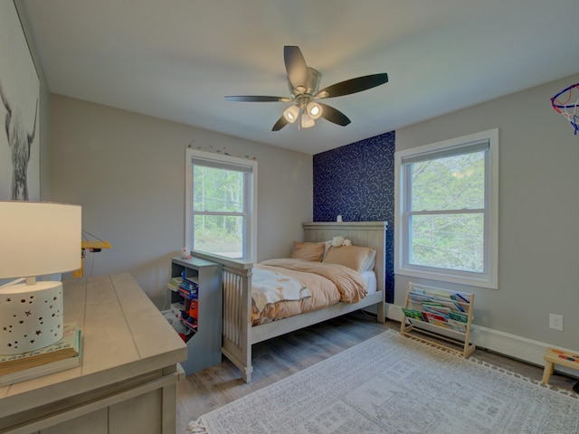 1026 Rte 171, Woodstock, CT 06281 - bedroom with light wood-type flooring, a ceiling fan, and baseboards