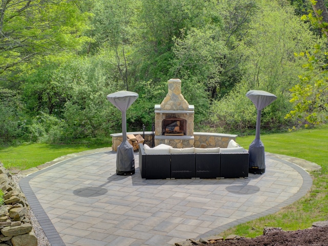 1026 Rte 171, Woodstock, CT 06281 - view of patio with an outdoor living space with a fireplace and a wooded view