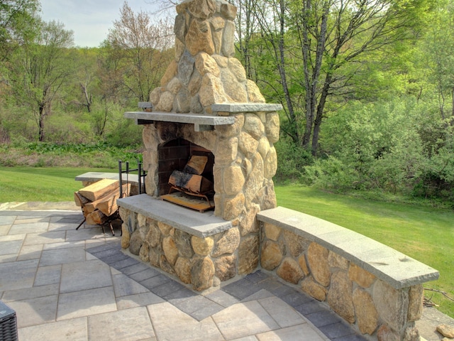 1026 Rte 171, Woodstock, CT 06281 - view of patio / terrace featuring an outdoor stone fireplace and a forest view