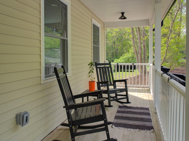 1026 Rte 171, Woodstock, CT 06281 - wooden deck featuring covered porch