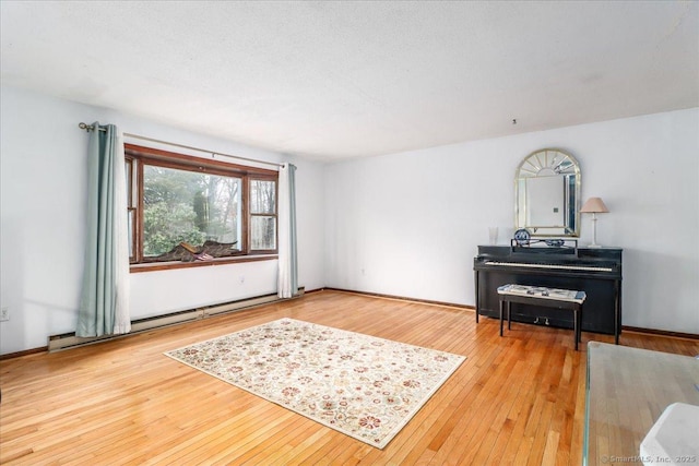 31 Branch Hill Rd, Preston, CT 06365 - living room with a baseboard heating unit and hardwood / wood-style floors