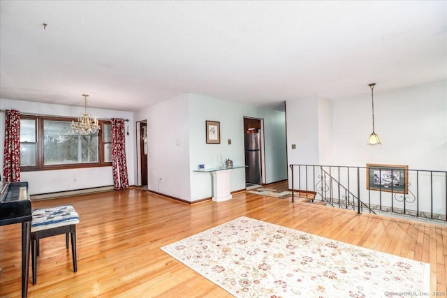 31 Branch Hill Rd, Preston, CT 06365 - living area with a chandelier, baseboard heating, wood finished floors, and baseboards