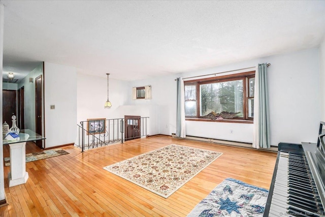 31 Branch Hill Rd, Preston, CT 06365 - living area featuring hardwood / wood-style floors, a baseboard radiator, and baseboards