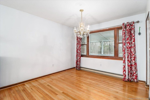 31 Branch Hill Rd, Preston, CT 06365 - spare room with a baseboard radiator, a chandelier, light wood-style flooring, and baseboards