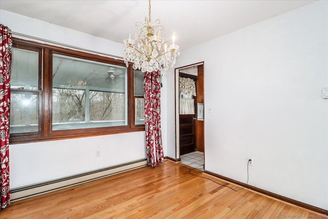 31 Branch Hill Rd, Preston, CT 06365 - spare room with baseboard heating, wood finished floors, a chandelier, baseboards, and a ceiling fan