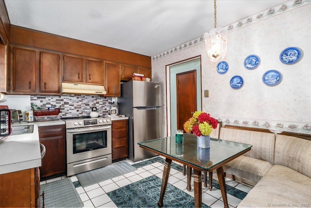 31 Branch Hill Rd, Preston, CT 06365 - kitchen featuring appliances with stainless steel finishes, under cabinet range hood, wallpapered walls, light countertops, and a sink