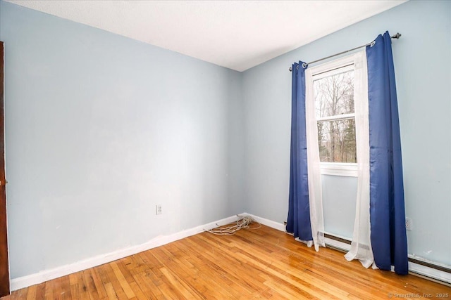 31 Branch Hill Rd, Preston, CT 06365 - empty room featuring light wood-style flooring, baseboards, and a baseboard radiator