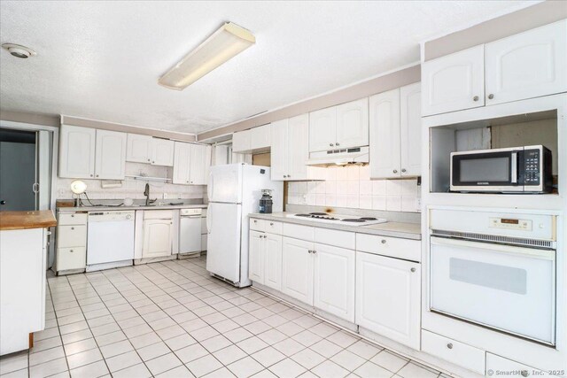 31 Branch Hill Rd, Preston, CT 06365 - kitchen with white appliances, under cabinet range hood, tasteful backsplash, and white cabinets