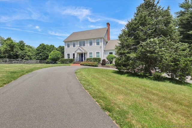 100 Round Hill Rd, Middletown, CT 06457 - colonial house featuring a chimney and asphalt driveway