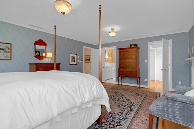 116 Thornbush Rd, Wethersfield, CT 06109 - bedroom with wood finished floors, ensuite bathroom, wallpapered walls, and ornamental molding