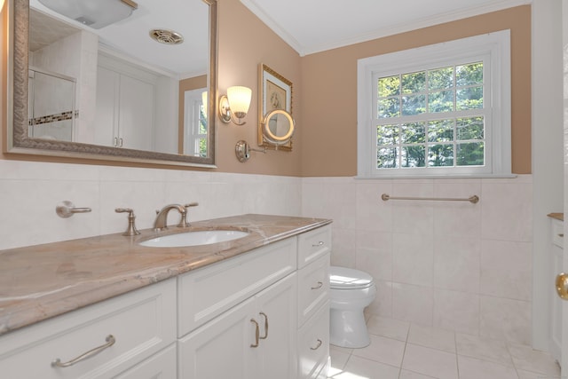 116 Thornbush Rd, Wethersfield, CT 06109 - full bath with tile walls, tile patterned floors, toilet, ornamental molding, and a stall shower