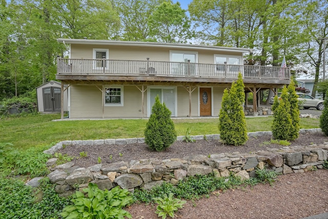 24 Cornell Rd, Danbury, CT 06811 - rear view of property with a wooden deck, a shed, a lawn, and an outbuilding