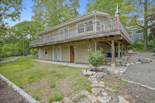 24 Cornell Rd, Danbury, CT 06811 - back of house featuring a deck, a patio, and a lawn