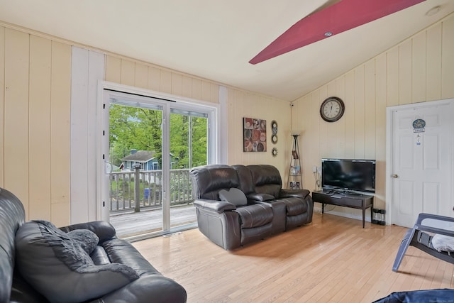 24 Cornell Rd, Danbury, CT 06811 - living room with hardwood / wood-style floors, wooden walls, and vaulted ceiling