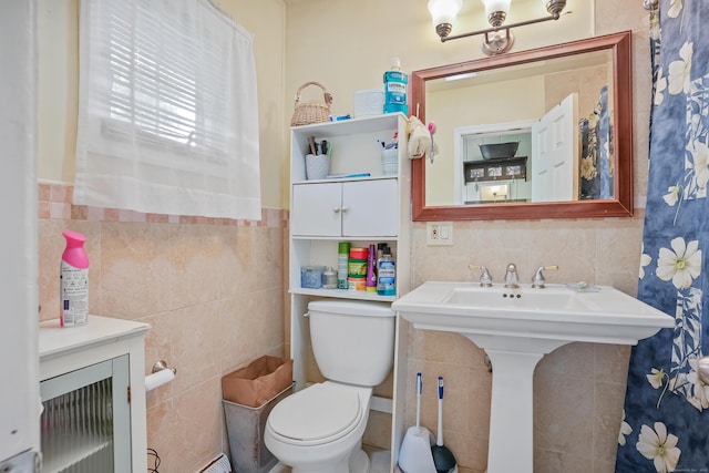 24 Cornell Rd, Danbury, CT 06811 - bathroom featuring tile walls, toilet, a sink, and wainscoting