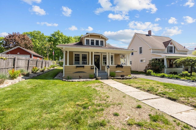bungalow-style home with covered porch and a shingled roof