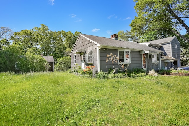 1 Cedar Rd, Danbury, CT 06811 - view of side of home featuring a chimney and roof with shingles