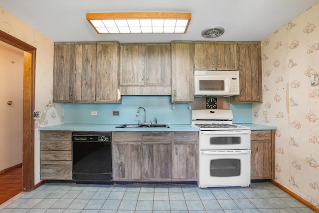 1 Cedar Rd, Danbury, CT 06811 - kitchen with white appliances, a sink, wallpapered walls, light countertops, and baseboards