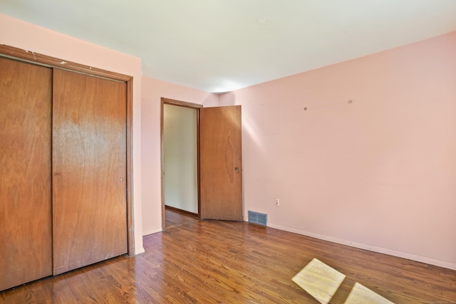 1 Cedar Rd, Danbury, CT 06811 - unfurnished bedroom with wood finished floors, a closet, and baseboards