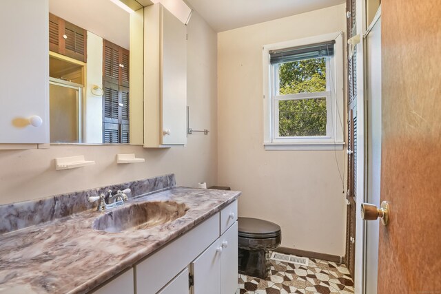 1 Cedar Rd, Danbury, CT 06811 - bathroom with vanity, toilet, and baseboards
