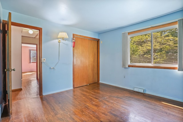 1 Cedar Rd, Danbury, CT 06811 - unfurnished bedroom featuring wood finished floors, baseboards, and a closet