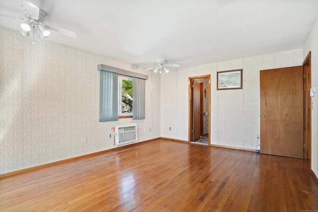 1 Cedar Rd, Danbury, CT 06811 - empty room featuring a ceiling fan, wood finished floors, wallpapered walls, an AC wall unit, and baseboards