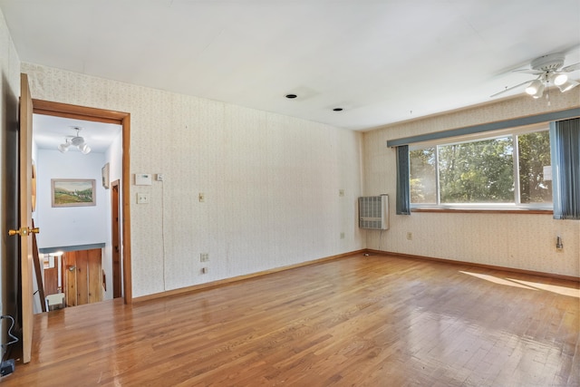 1 Cedar Rd, Danbury, CT 06811 - unfurnished room featuring wood finished floors, wallpapered walls, heating unit, ceiling fan, and baseboards