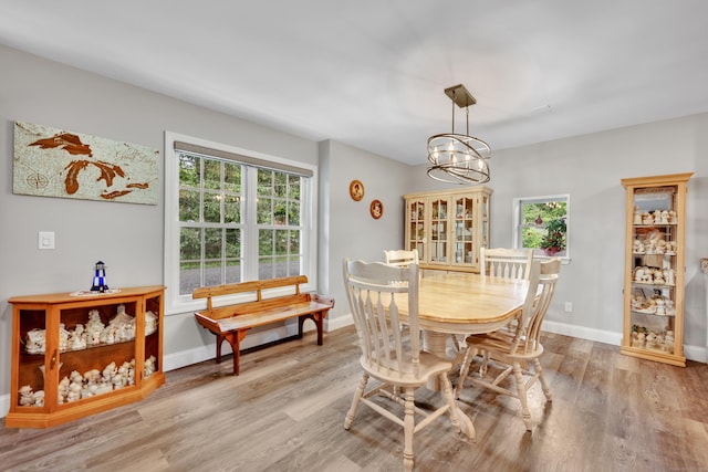 3 Lynns Corner Rd, Woodbury, CT 06798 - dining area with light wood-style floors, healthy amount of natural light, and a chandelier