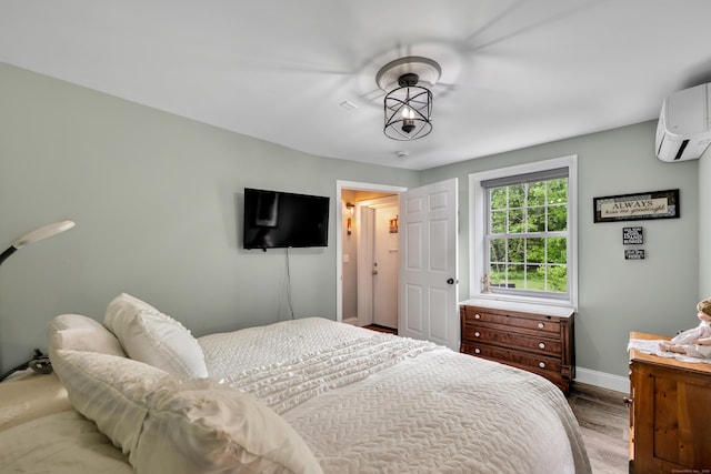 3 Lynns Corner Rd, Woodbury, CT 06798 - bedroom featuring an AC wall unit and wood finished floors