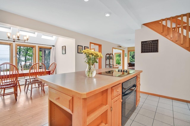 33 Erdoni Rd, Columbia, CT 06237 - kitchen featuring black appliances, a kitchen island, light brown cabinetry, and a chandelier