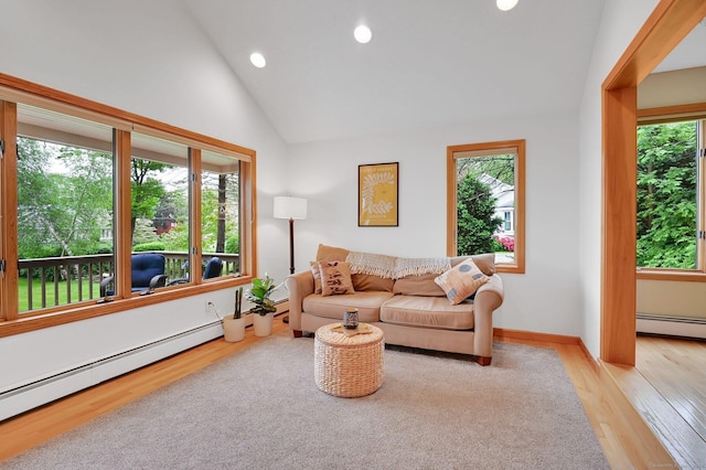 33 Erdoni Rd, Columbia, CT 06237 - living area featuring a baseboard heating unit, recessed lighting, light wood finished floors, and lofted ceiling