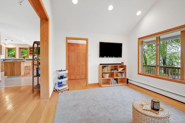 33 Erdoni Rd, Columbia, CT 06237 - living area with light wood-style flooring, a baseboard heating unit, lofted ceiling, recessed lighting, and baseboards