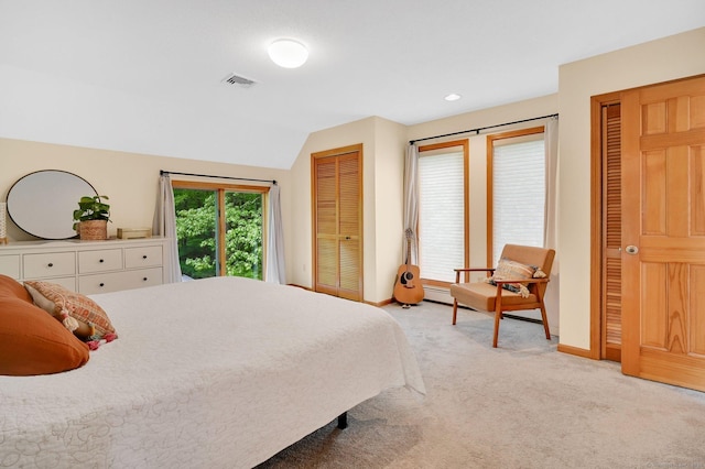 33 Erdoni Rd, Columbia, CT 06237 - bedroom with light colored carpet, lofted ceiling, baseboards, two closets, and recessed lighting