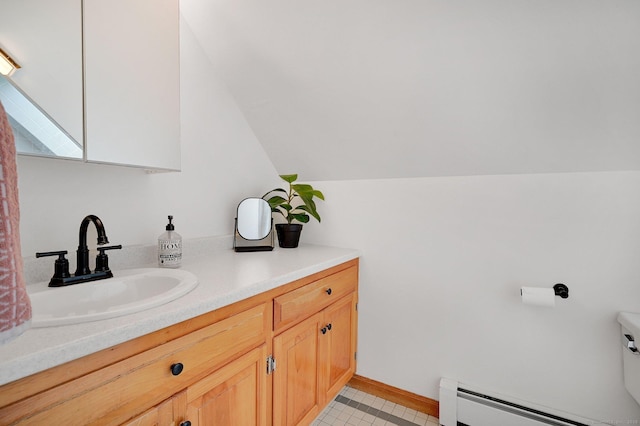 33 Erdoni Rd, Columbia, CT 06237 - bathroom with a baseboard heating unit, vanity, lofted ceiling, toilet, and baseboards