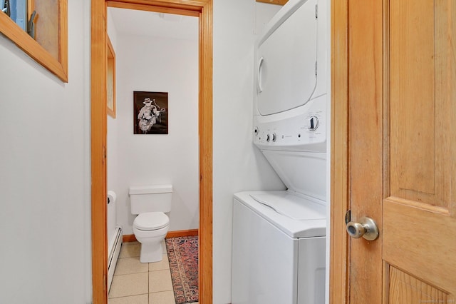 33 Erdoni Rd, Columbia, CT 06237 - laundry area featuring estacked washer and dryer, baseboard heating, light tile patterned flooring, and baseboards