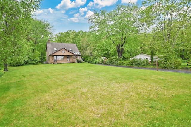 33 Erdoni Rd, Columbia, CT 06237 - view of green lawn with a wooden deck