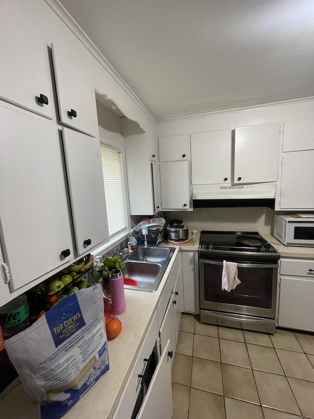 1315 Hamilton Ave, Waterbury, CT 06706 - kitchen with stainless steel electric range, under cabinet range hood, white microwave, light countertops, and a sink
