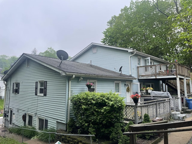 1315 Hamilton Ave, Waterbury, CT 06706 - rear view of house with a wooden deck, roof with shingles, and stairway
