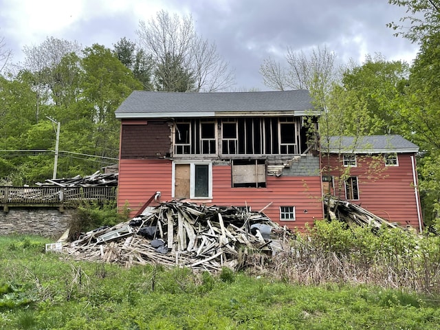 rear view of property with a sunroom