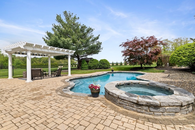 view of swimming pool with a patio area, a pergola, fence, and a pool with connected hot tub
