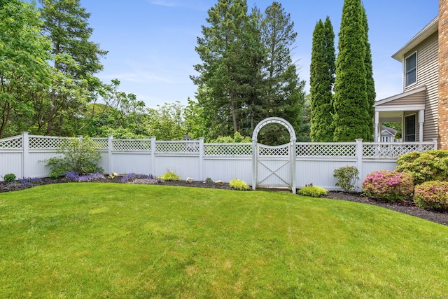 view of yard with a gate